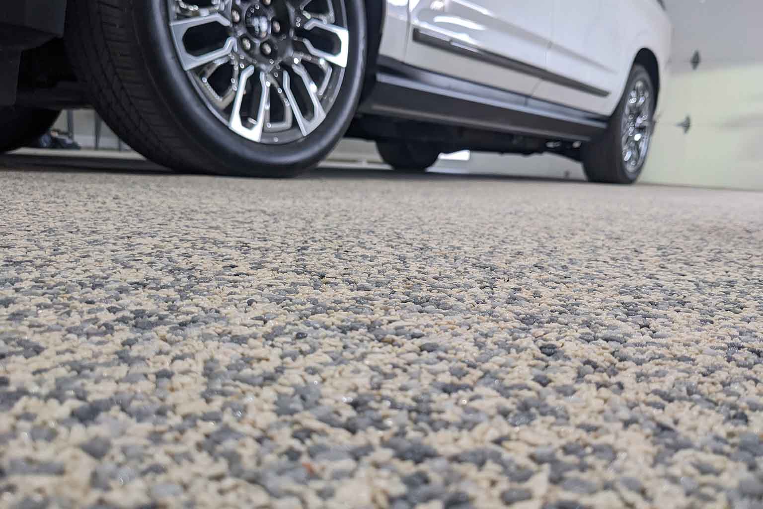 Close-up of premium Vuba Stone resin bound surface showcasing natural stone texture and seamless finish