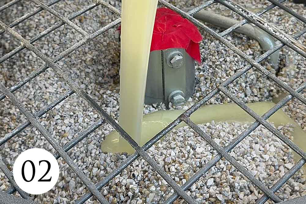 Precision-Mixing Premium polyurethane resin being mixed with natural stone aggregates during a Vuba Stone installation